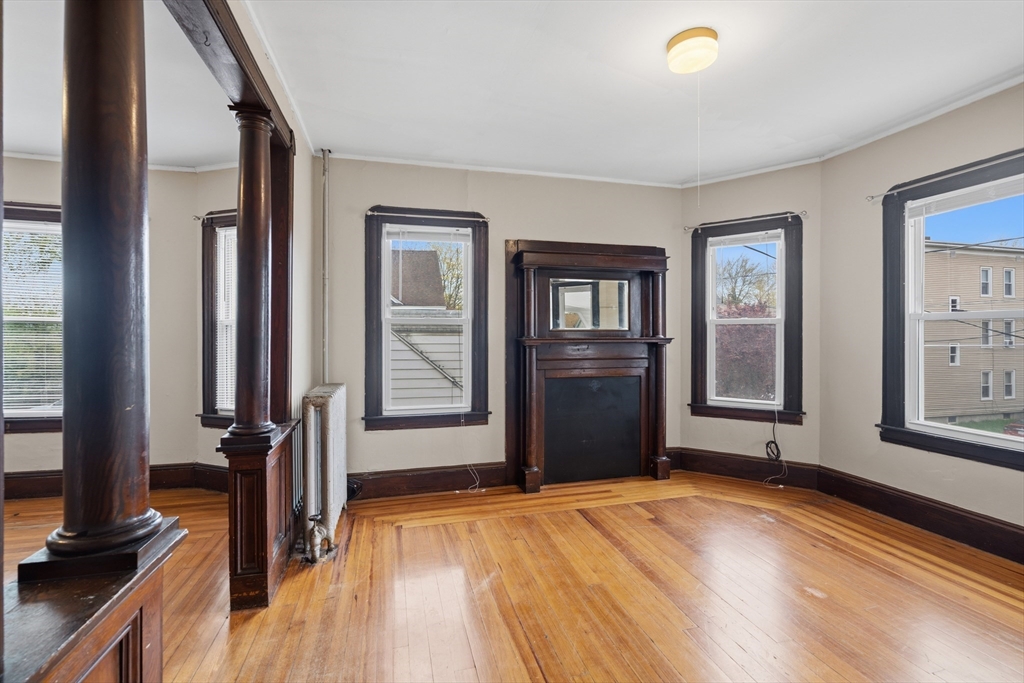 43 Elmdale Street, Unit 2 West Springfield, MA 01089 - Photo 2 of 14 a view of a livingroom with wooden floor and a window