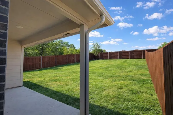 a view of a backyard with a garden