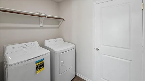 a utility room with dryer and washer