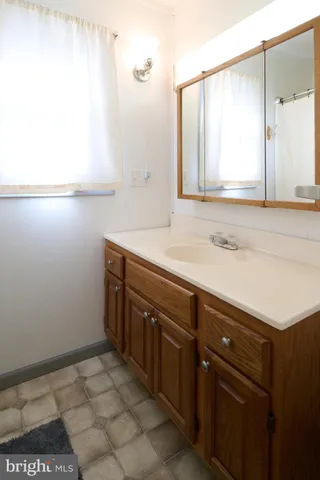 a bedroom with a bed and a lamp