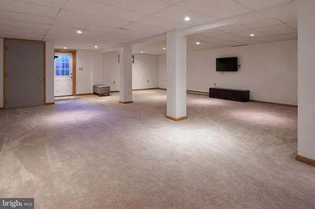 a bedroom with a bed and a desk