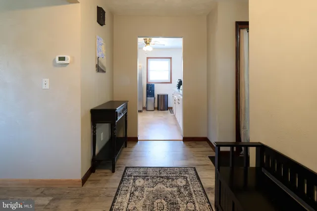 a hallway with wooden floor