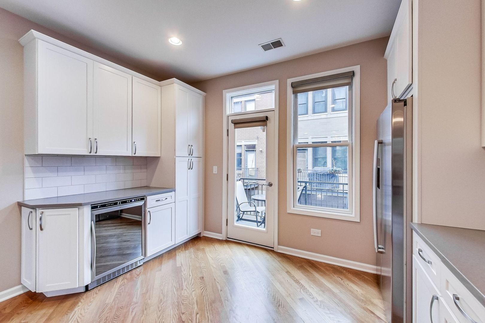 640 West Oak Street Chicago, IL 60610 - Photo 17 of 43 a view of an empty room with window and wooden floor