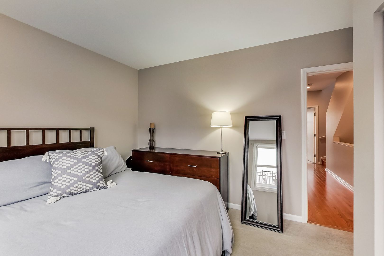 640 West Oak Street Chicago, IL 60610 - Photo 28 of 43 a bedroom with a bed and a mirror