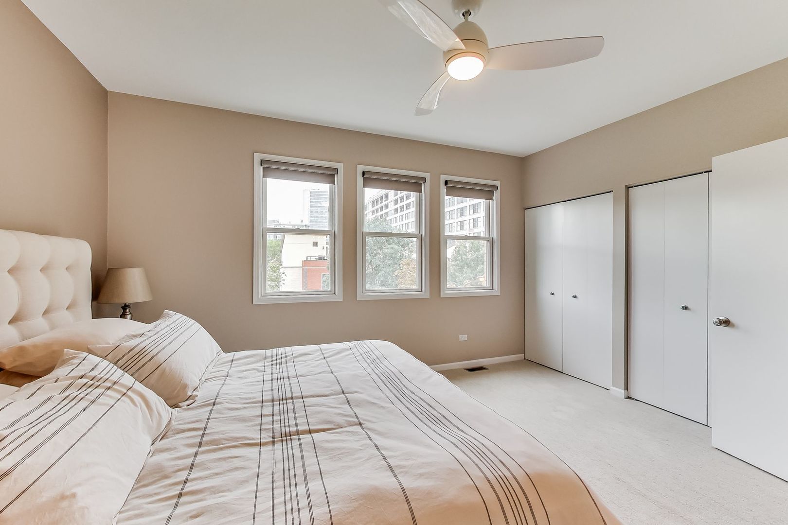 640 West Oak Street Chicago, IL 60610 - Photo 31 of 43 a bedroom with a large bed and a window