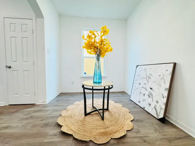 a living room with furniture and a table
