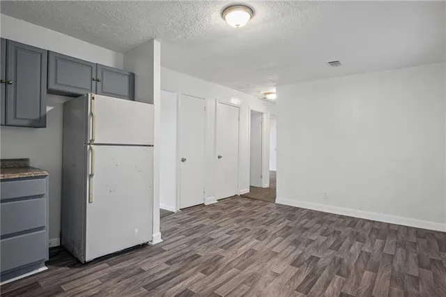 a view of a kitchen with closet and wooden floor