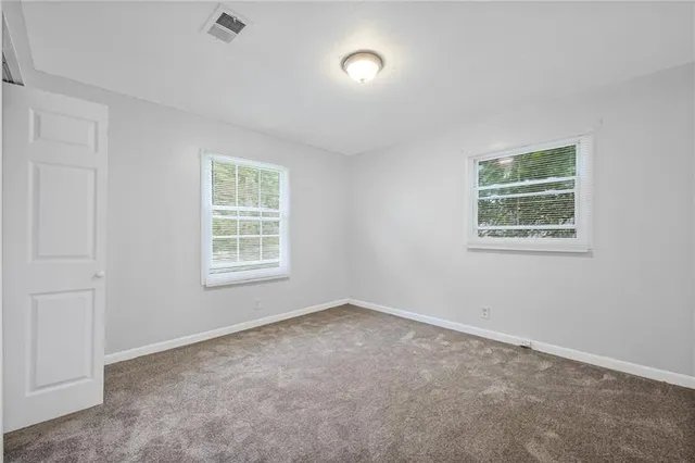 an empty room with windows