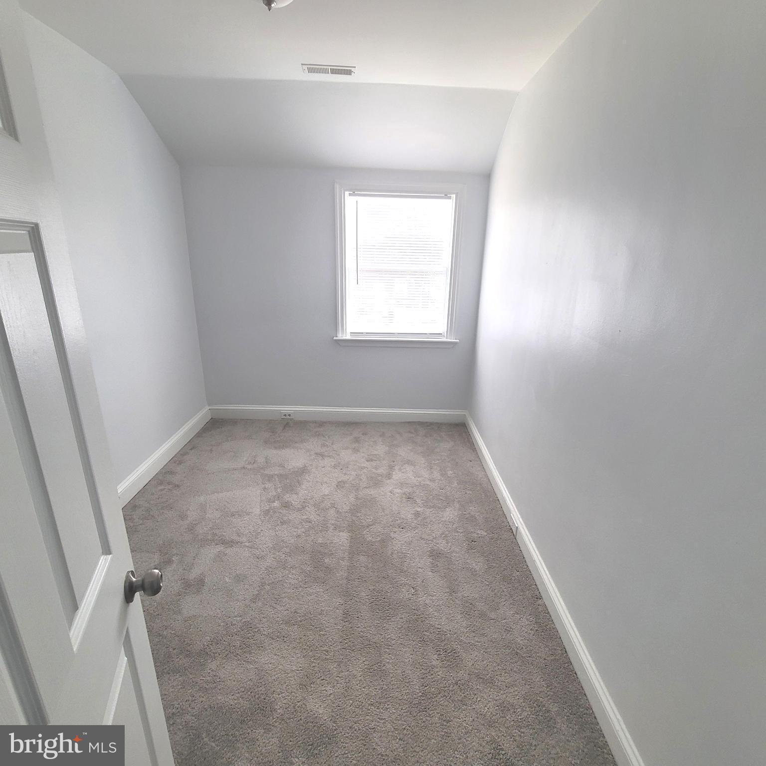 4603 Marble Hall Road Baltimore, MD 21239 - Photo 12 of 24 an empty room with a window