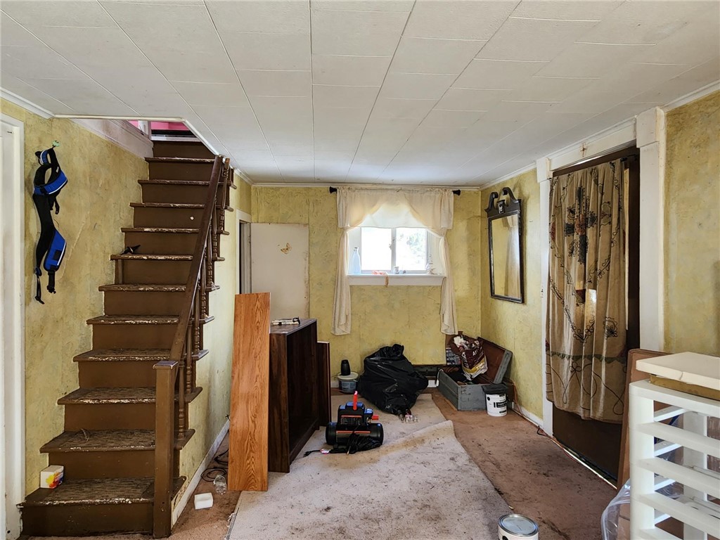 4276 Robinson Road Wethersfield, NY 14569 - Photo 8 of 24 Living room, stairs to 2nd floor