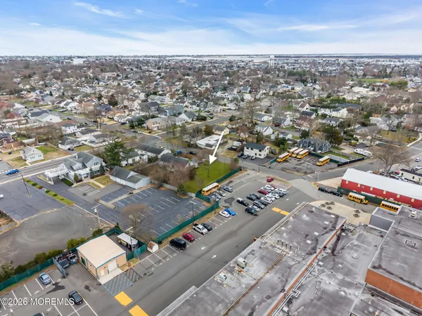 an aerial view of a city with parking