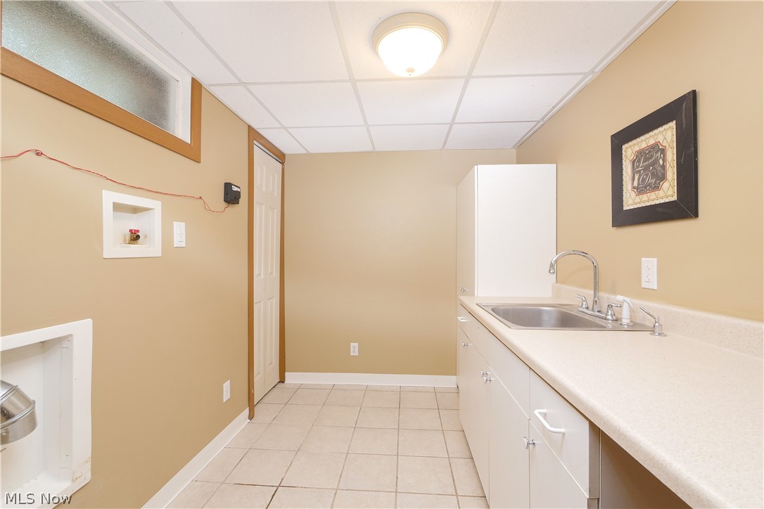 6475 Kungle Road Clinton, OH 44216 - Photo 29 of 35 Laundry room with sink