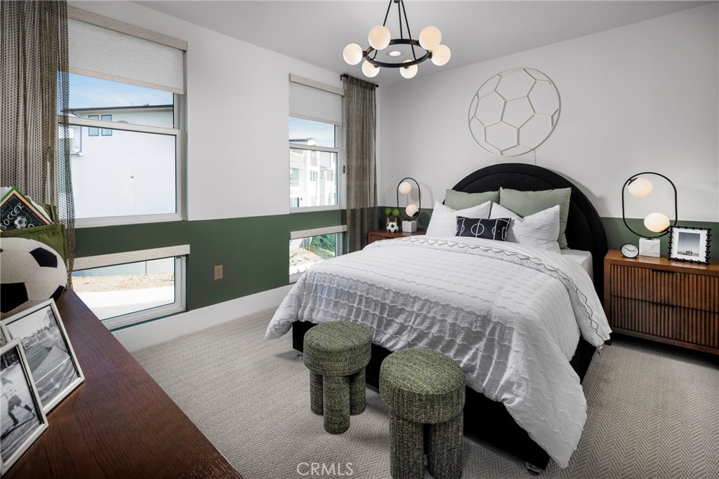 136 Creation Irvine, CA 92618 - Photo 12 of 18 a bed sitting in a bedroom next to a window with chandelier