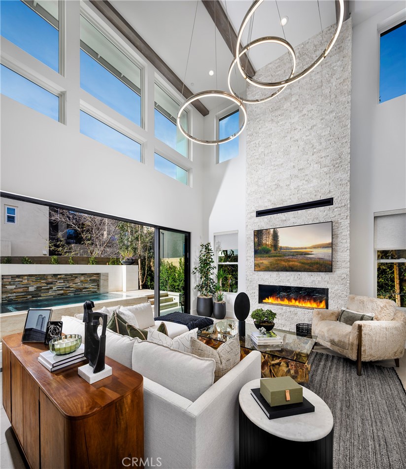 136 Creation Irvine, CA 92618 - Photo 2 of 18 a kitchen with stainless steel appliances granite countertop a stove and a living room view