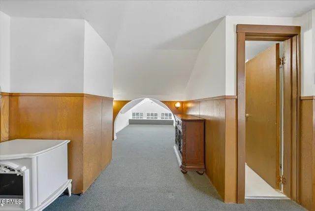 a view of an empty room and a window