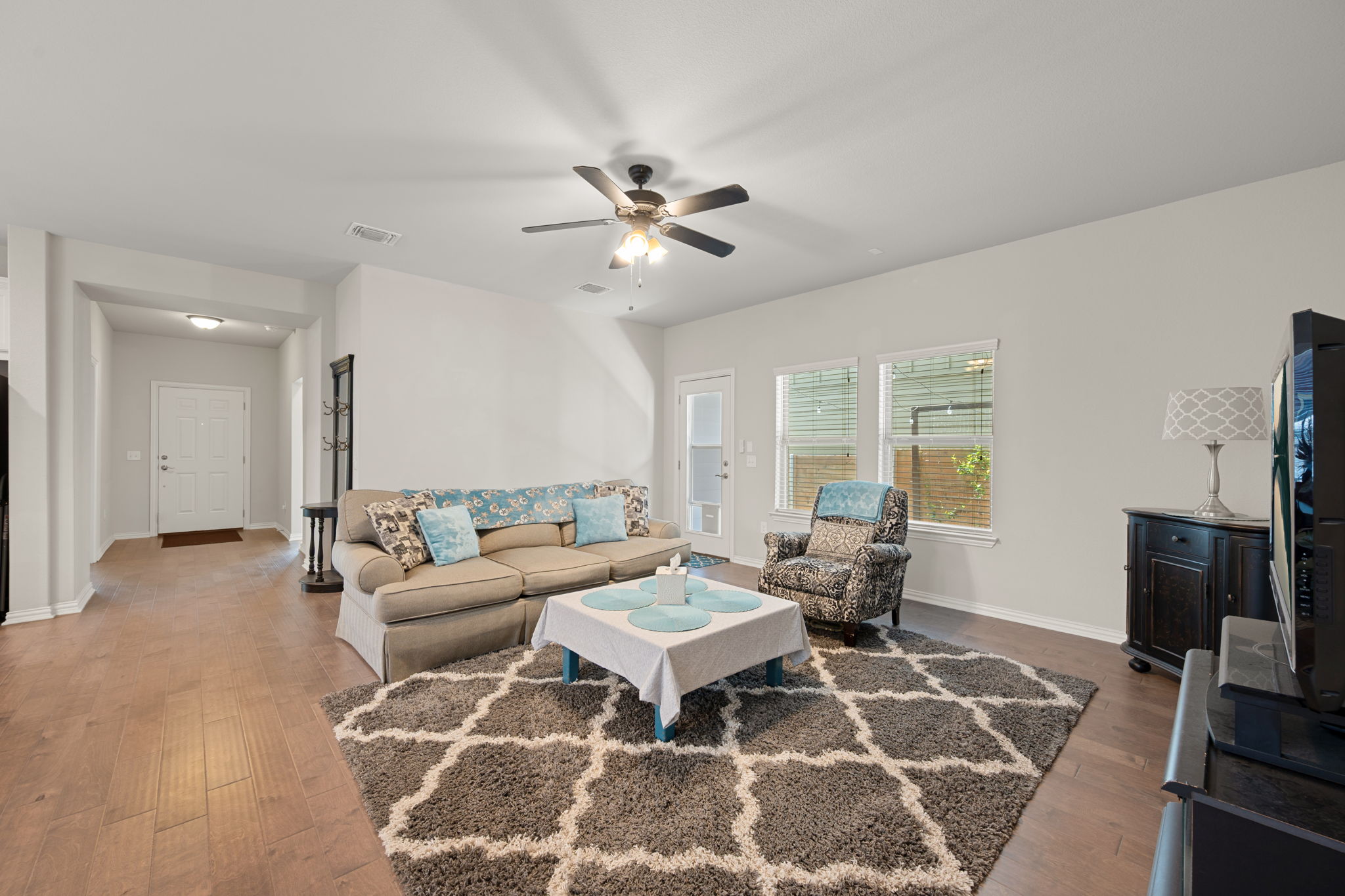 8800 Slater Drive Austin, TX 78747 - Photo 13 of 40 a living room with furniture and a flat screen tv