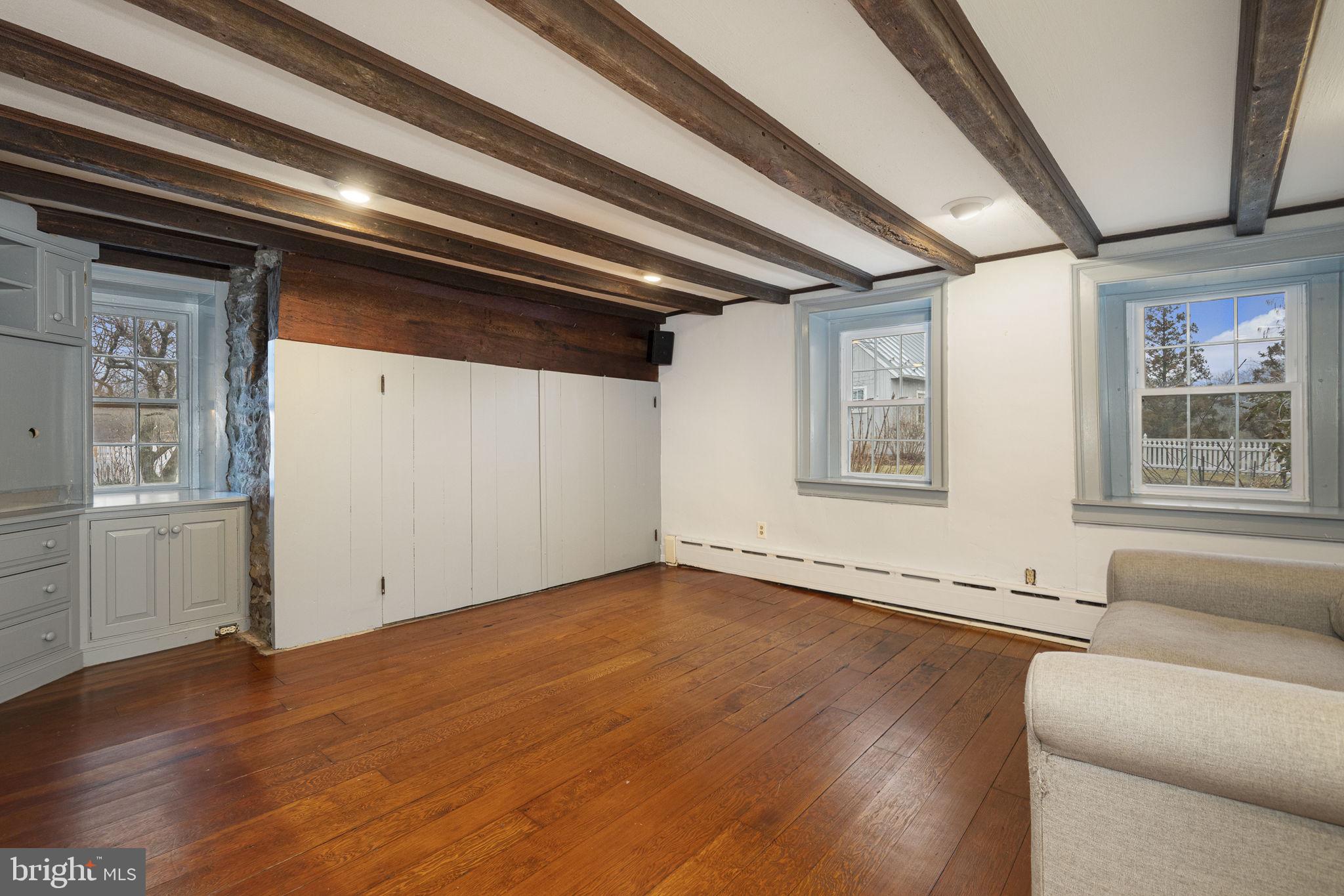 371 Old Tulpehocken Road Birdsboro, PA 19508 - Photo 29 of 99 a view of a livingroom with wooden floor and windows