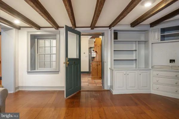 a view of an entryway with wooden floor
