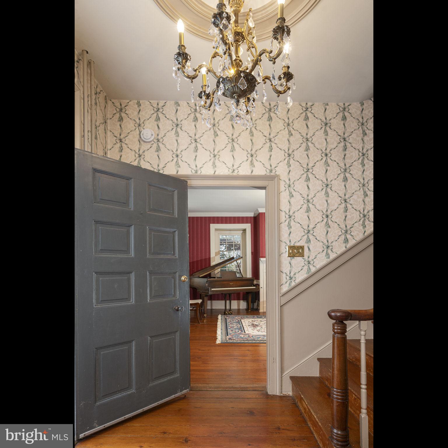 371 Old Tulpehocken Road Birdsboro, PA 19508 - Photo 35 of 99 a hallway with a bench and a chandelier