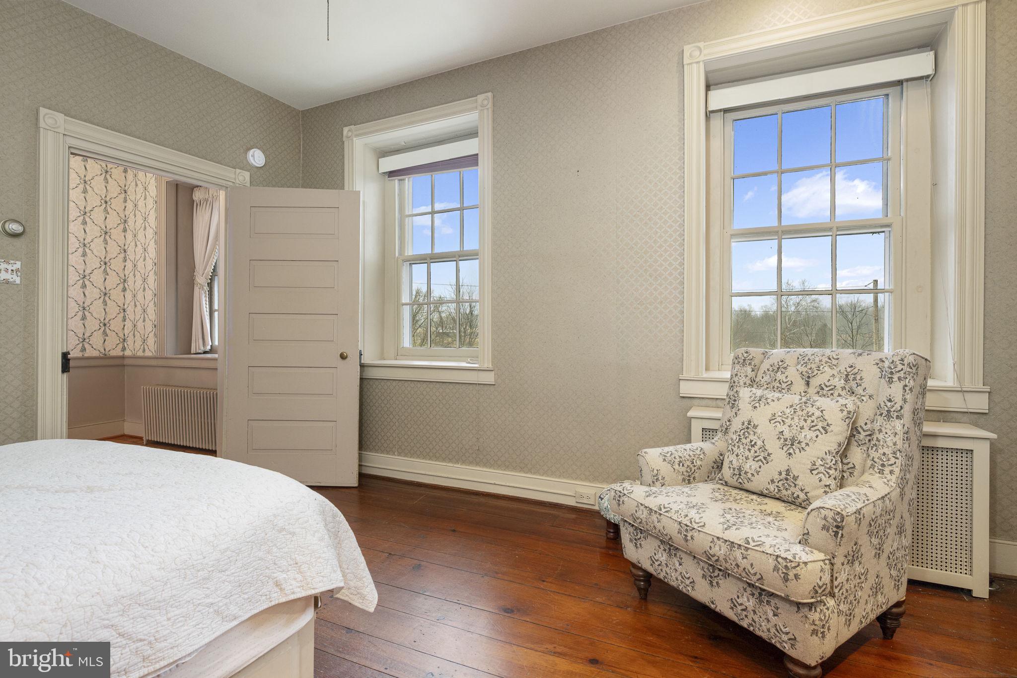 371 Old Tulpehocken Road Birdsboro, PA 19508 - Photo 40 of 99 a bedroom with a bed and a couch with window