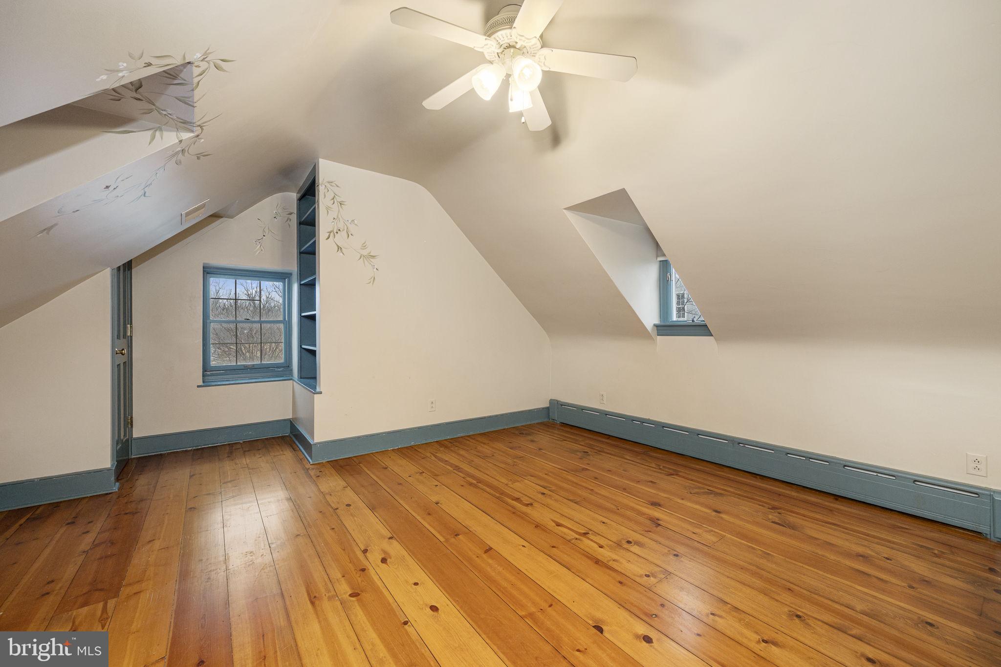 371 Old Tulpehocken Road Birdsboro, PA 19508 - Photo 45 of 99 a view of an empty room with wooden floor and a ceiling fan