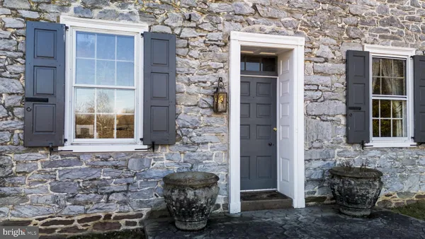 a kitchen with granite countertop a sink and cabinets