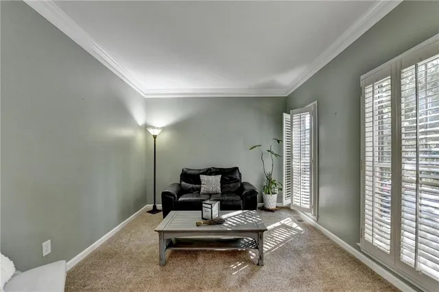 a living room with furniture or wooden floor and a flat screen tv