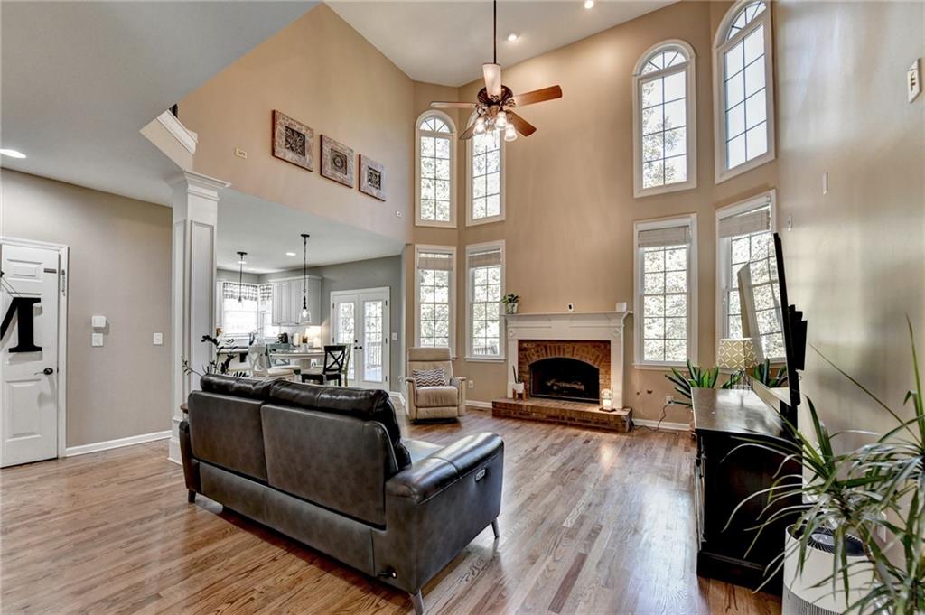 1973 Hamilton Mill Parkway Dacula, GA 30019 - Photo 19 of 105 a living room with furniture fireplace and wooden floor