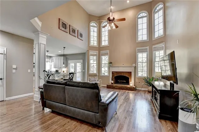 a view of a kitchen with kitchen island dining table and a large window