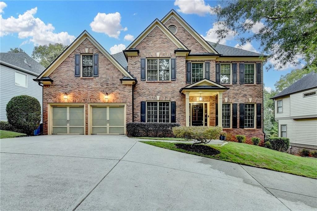 1973 Hamilton Mill Parkway Dacula, GA 30019 - Photo 2 of 105 a front view of a house with garden