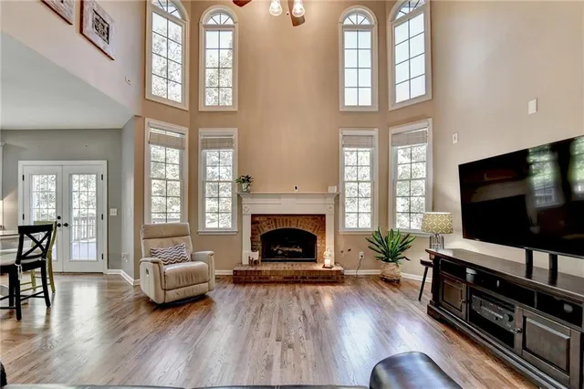 a kitchen with stainless steel appliances granite countertop a sink a stove and cabinets