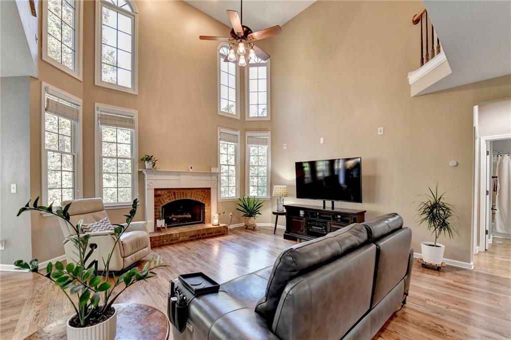 1973 Hamilton Mill Parkway Dacula, GA 30019 - Photo 22 of 105 a living room with furniture fireplace and flat screen tv