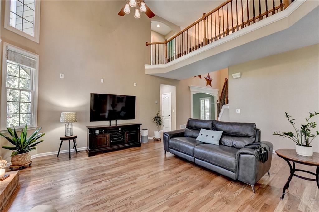 1973 Hamilton Mill Parkway Dacula, GA 30019 - Photo 24 of 105 a living room with furniture and a flat screen tv
