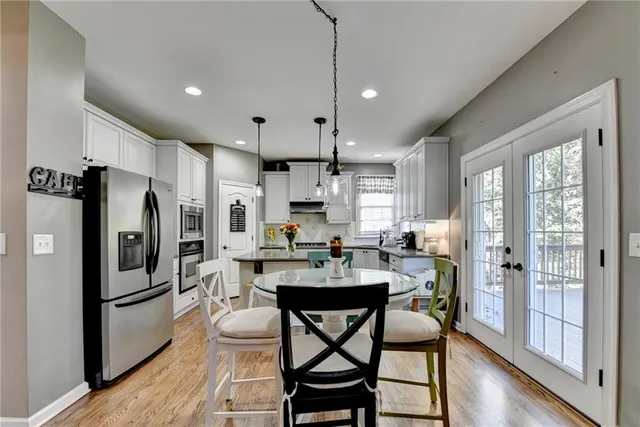 a bedroom with a bed and a large mirror