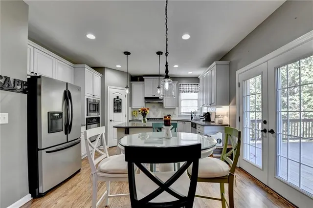 a view of a livingroom with workspace and a window