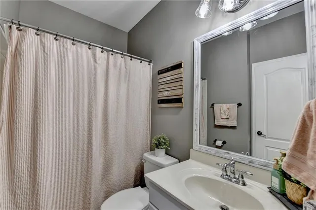 a workspace with chandelier fan and windows