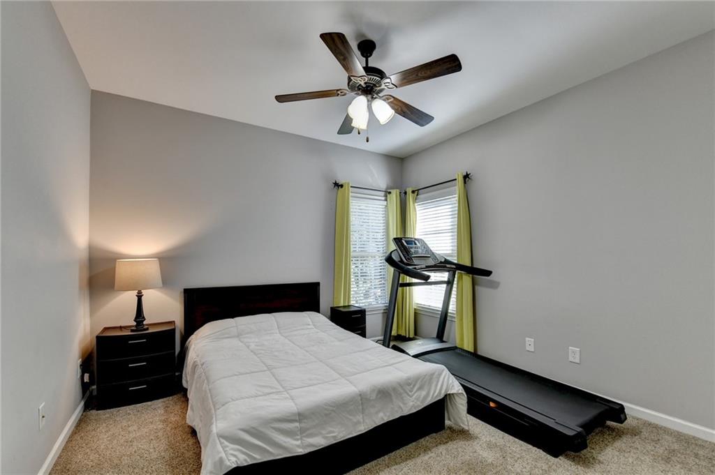 1973 Hamilton Mill Parkway Dacula, GA 30019 - Photo 39 of 105 a bedroom with a bed and window