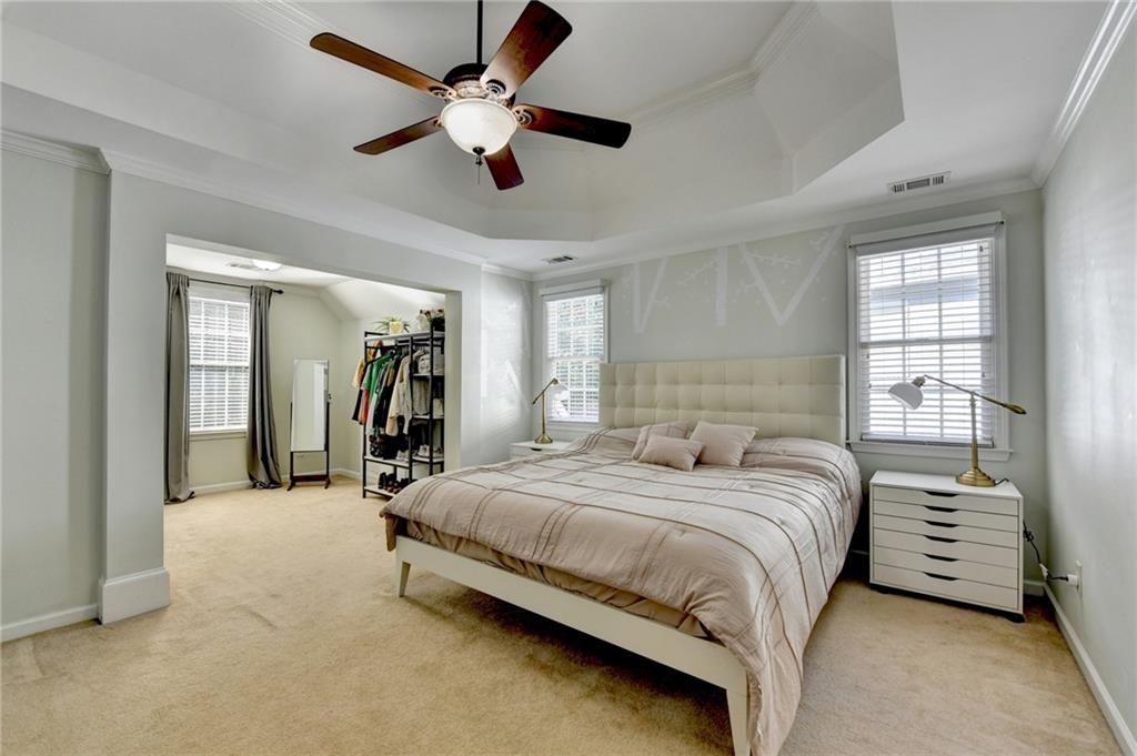 1973 Hamilton Mill Parkway Dacula, GA 30019 - Photo 44 of 105 a bedroom with a bed and a large mirror