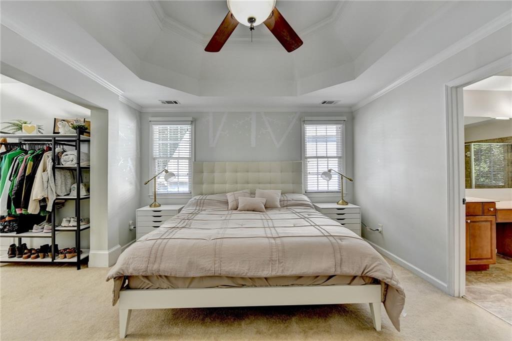 1973 Hamilton Mill Parkway Dacula, GA 30019 - Photo 45 of 105 a bedroom with a bed and a window