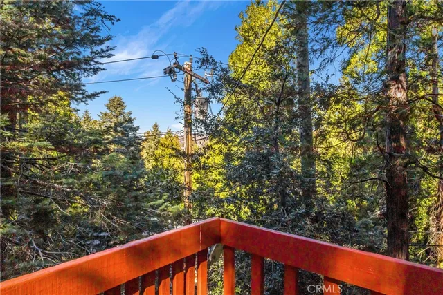 a wooden bench sitting in front of a building
