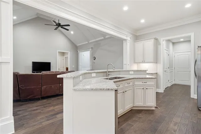 a view of living room with granite countertop furniture and fireplace