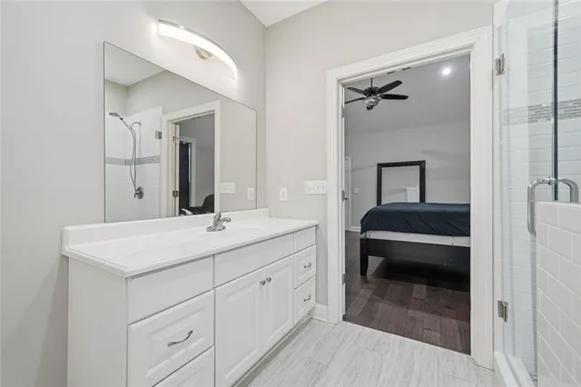 a en suite bathroom with a sink and a mirror