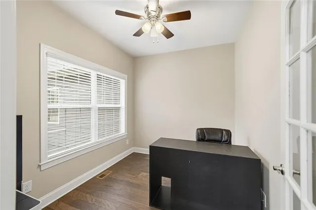 a view of workspace with furniture and window