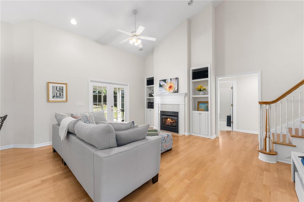 7418 White Oaks Road Alachua, FL 32615 - Photo 32 of 46 a living room with furniture and a fireplace