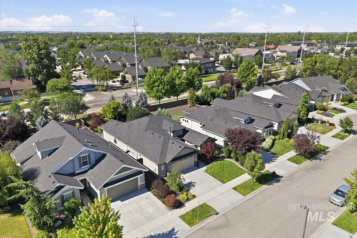 1303 West Brando Street Meridian, ID 83646 - Photo 45 of 49 Residential street featuring multiple single-family homes with pitched roofs and attached garages