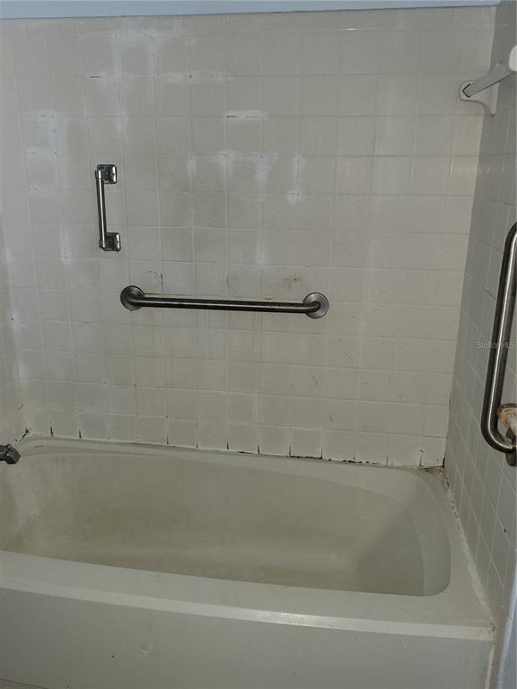 653 Atlas Avenue Northeast Palm Bay, FL 32905 - Photo 11 of 24 a bathroom with a shower