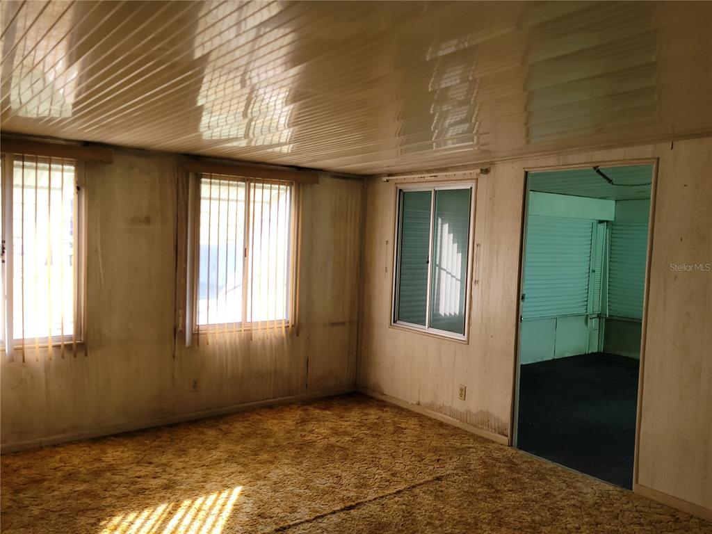 653 Atlas Avenue Northeast Palm Bay, FL 32905 - Photo 20 of 24 an empty room with windows