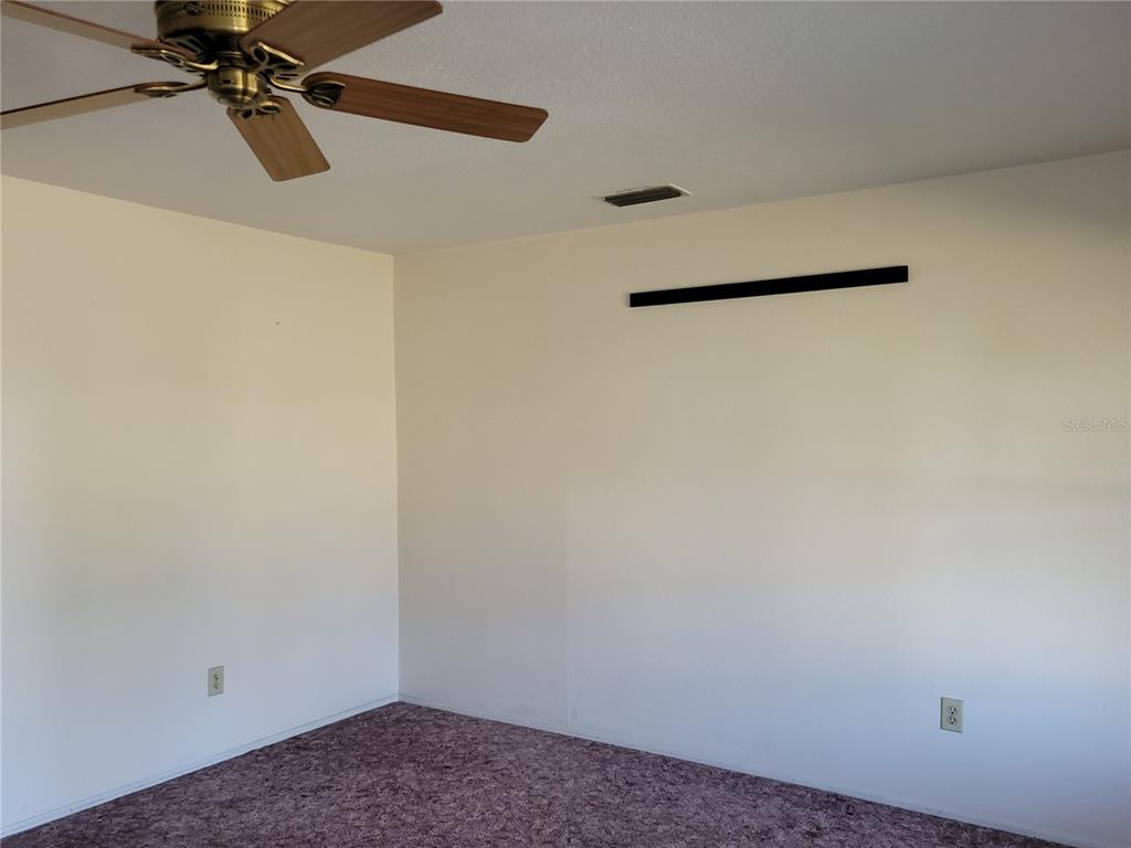 653 Atlas Avenue Northeast Palm Bay, FL 32905 - Photo 23 of 24 a view of a wall with in the kitchen