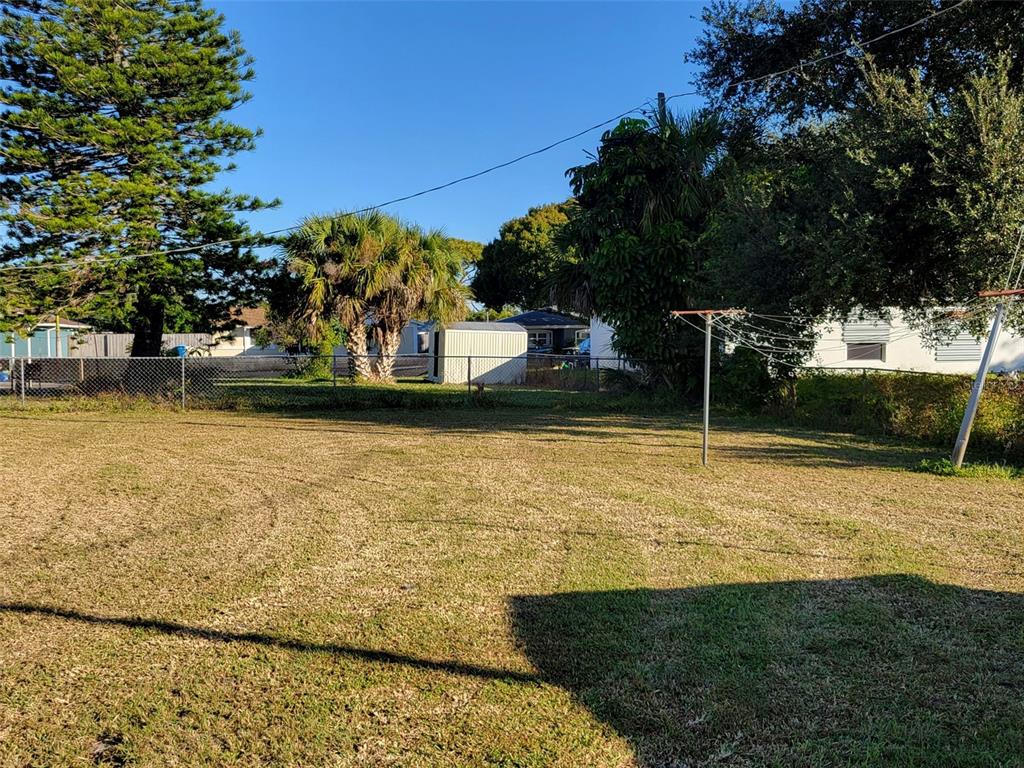 653 Atlas Avenue Northeast Palm Bay, FL 32905 - Photo 3 of 24 a view of a yard with an outdoor space