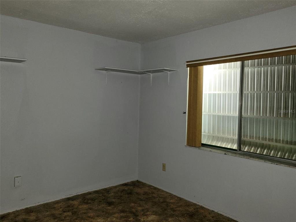 653 Atlas Avenue Northeast Palm Bay, FL 32905 - Photo 7 of 24 a small space with a window